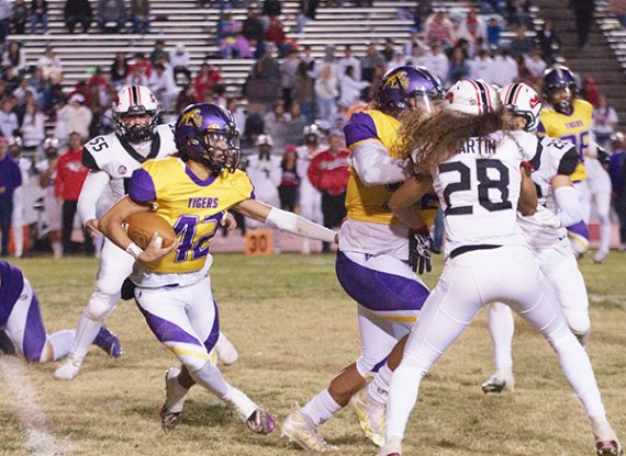 Ty Chambers, No. 42, picks up a first down Friday against visiting Hanford High School.